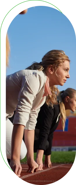 Business professionals lined up at a running track start line, symbolizing competition, ambition, and teamwork.